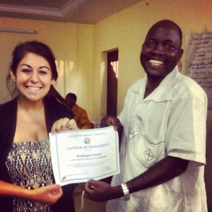 UW-Madison graduate Natalie Moore holding up a working certificate with the head nurse at the clinic she worked at in Burkina Faso.  Source: Natalie Moore